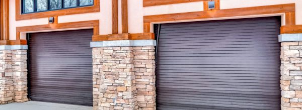 Why Your Garage Door Is Making Noise And What to Do 1 Garage Door service in Charleston SC Modern brown garage doors with stone and wood accents on a home exterior.